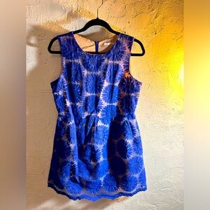 Party dress in purple by Ellison, mini w scalloped hem. Nude under lovely purple